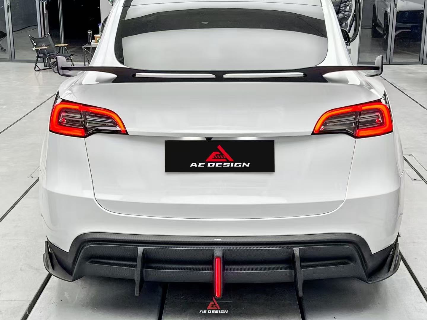 Tesla Model Y 2020 2021 2022 2023 2024 with Aftermarket Parts - AE Style Rear Diffuser Carbon Fiber from  ArmorExtend