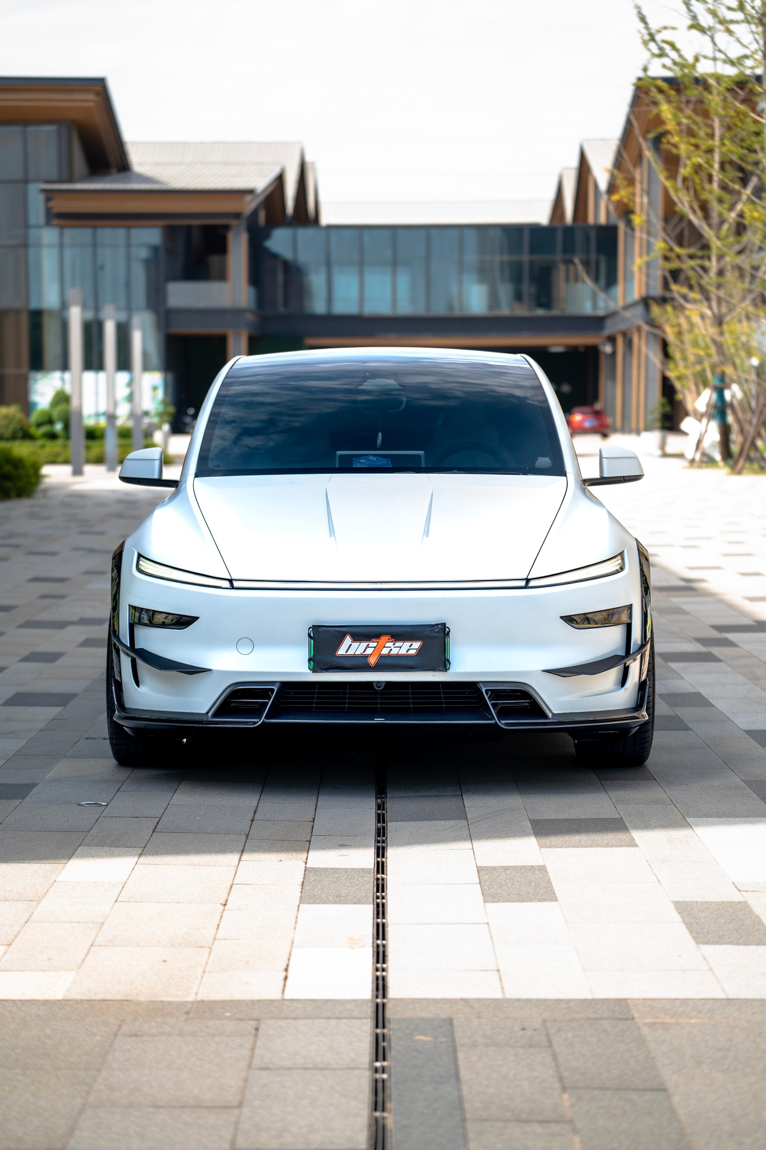 Tesla Model Y Juniper 2026-ON with Aftermarket Parts - Front Lip Dry Pre-preg Carbon Fiber from BCTXE Tuning