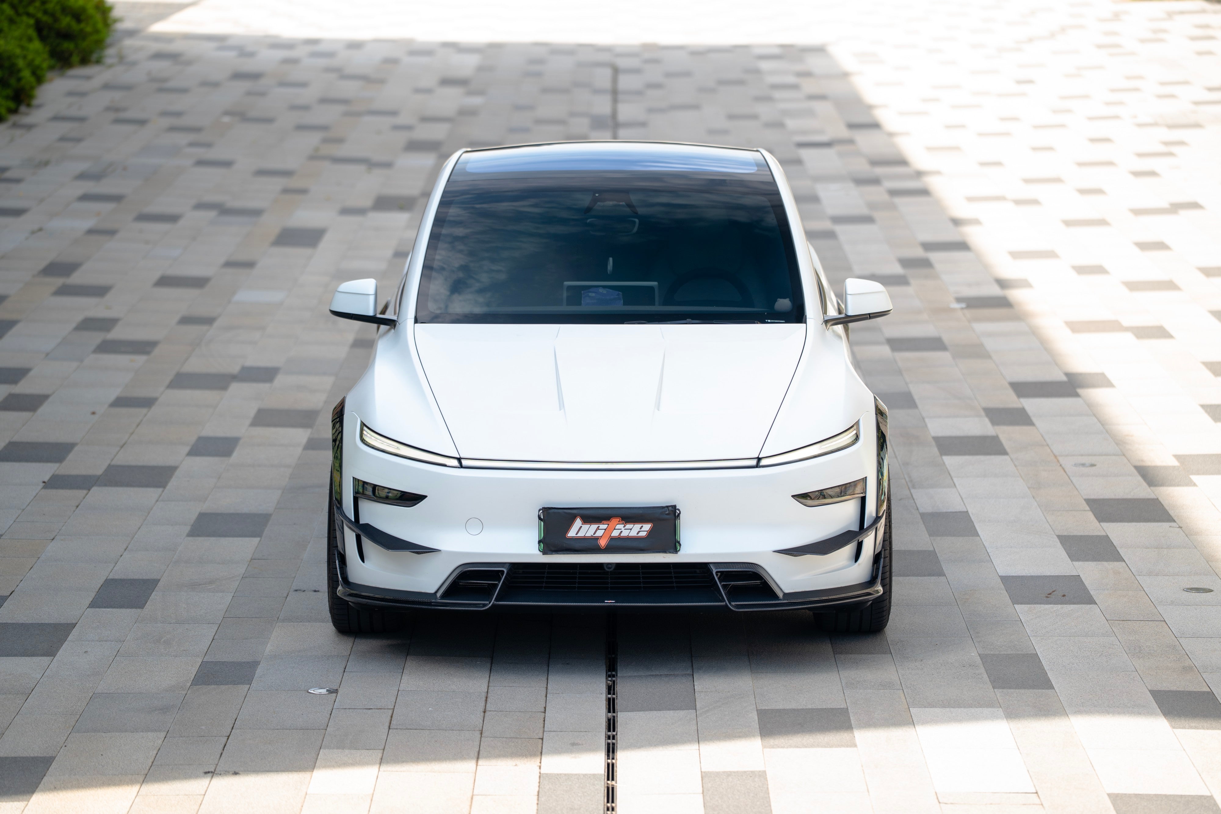 Tesla Model Y Juniper 2026-ON with Aftermarket Parts - Front Lip Dry Pre-preg Carbon Fiber from BCTXE Tuning