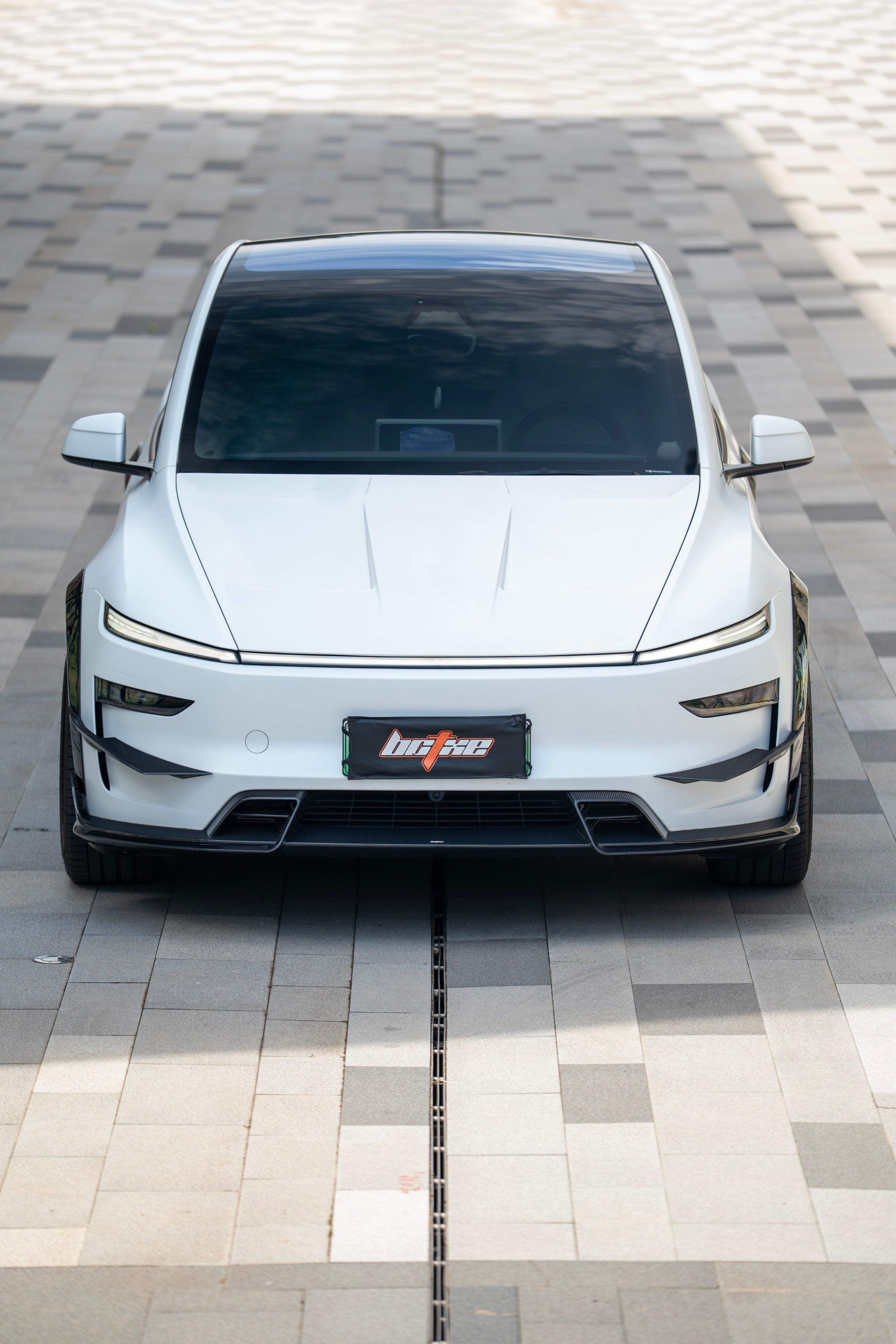 Tesla Model Y Juniper 2026-ON with Aftermarket Parts - Front Lip Dry Pre-preg Carbon Fiber from BCTXE Tuning