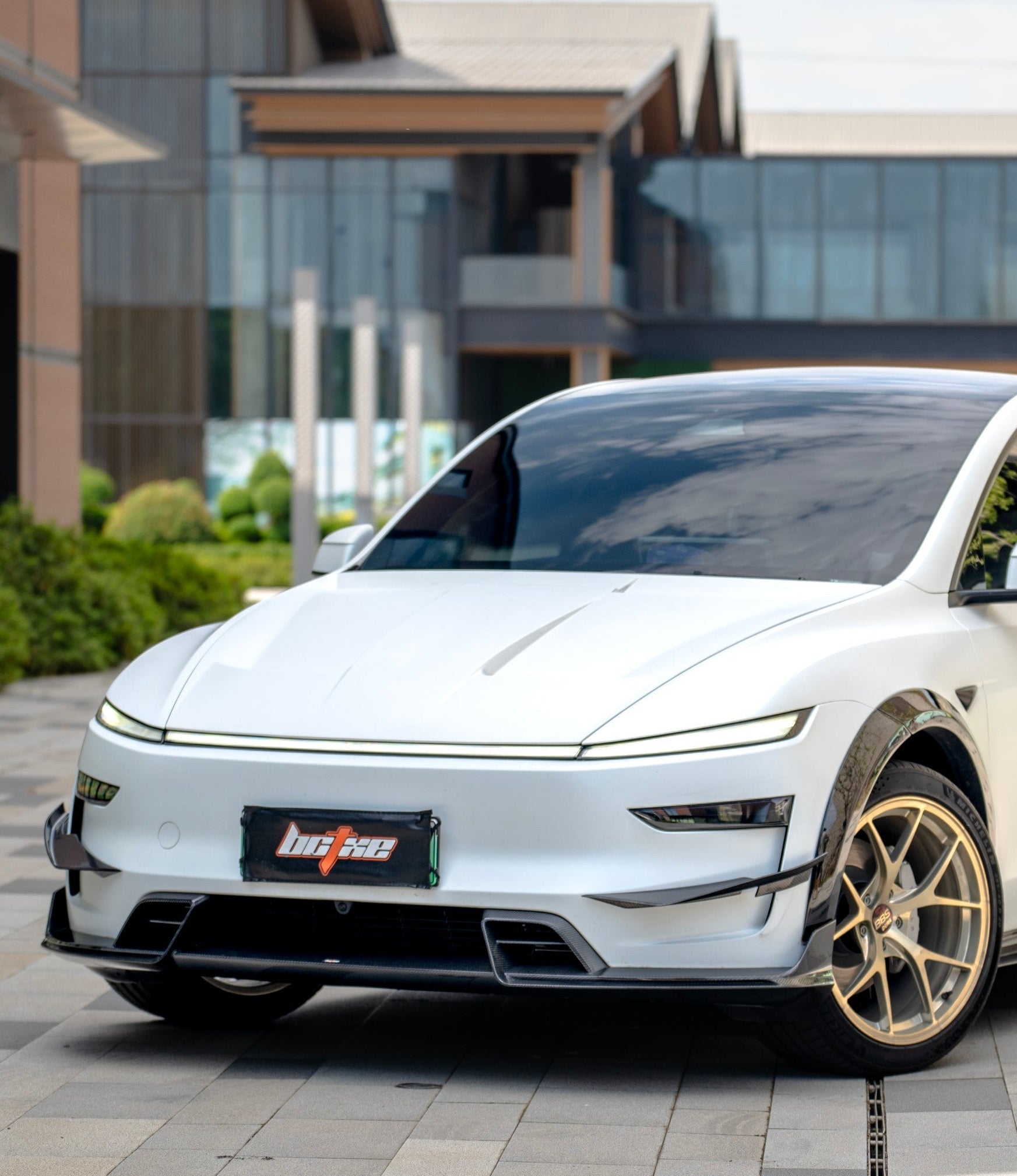 Tesla Model Y Juniper 2026-ON with Aftermarket Parts - Front Lip Dry Pre-preg Carbon Fiber from BCTXE Tuning