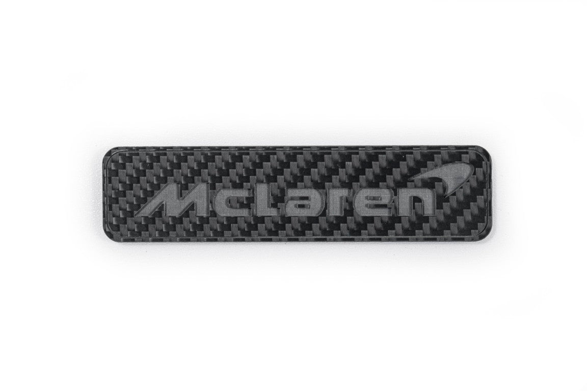 McLaren 570GT 2017 2018 2019 & 540C 570S 2016 2017 2018 2019 2020 & 600LT 2019 2020 & 620R 2021 & 675LT 650S 2015 2016 & 720S 2018 2019 2020 2021 2022 2023 & 750S 2024-ON & 765LT 2021 2022 & Artura 2023-ON & Elva 2021 & GT 2020 2021 2022 2023 & GTS 2025-ON & MP4-12C 2012 2013 2014 & P1 2013 2014 2015 & Senna 2019 2020 with Aftermarket Parts - Emblem Badge Carbon Fiber