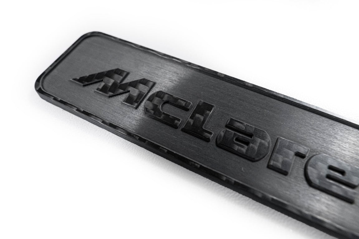 McLaren 570GT 2017 2018 2019 & 540C 570S 2016 2017 2018 2019 2020 & 600LT 2019 2020 & 620R 2021 & 675LT 650S 2015 2016 & 720S 2018 2019 2020 2021 2022 2023 & 750S 2024-ON & 765LT 2021 2022 & Artura 2023-ON & Elva 2021 & GT 2020 2021 2022 2023 & GTS 2025-ON & MP4-12C 2012 2013 2014 & P1 2013 2014 2015 & Senna 2019 2020 with Aftermarket Parts - Emblem Badge Carbon Fiber