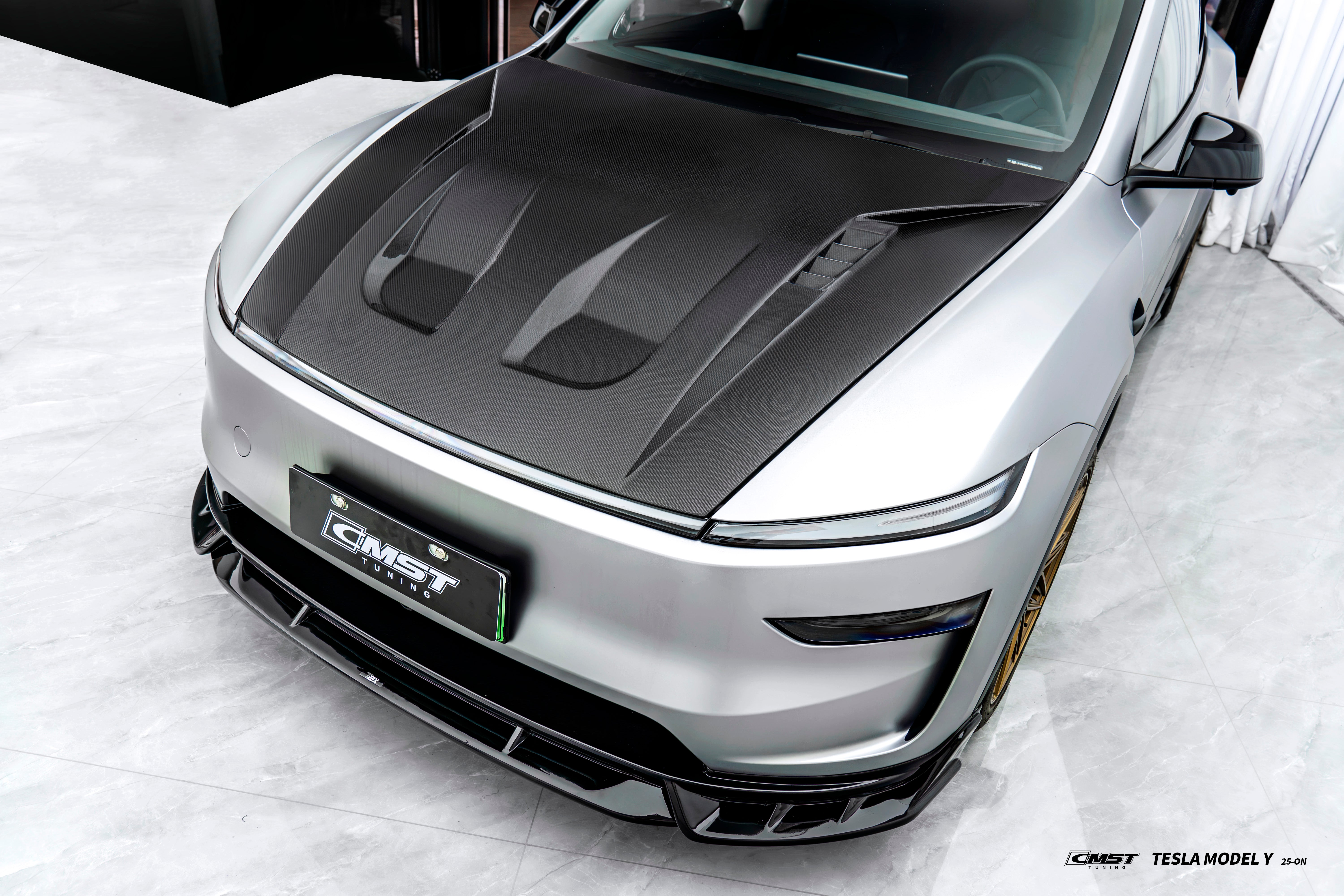 Tesla Model Y Juniper 2026-ON with Aftermarket Parts - V1 Hood Carbon Fiber / FRP from CMST Tuning